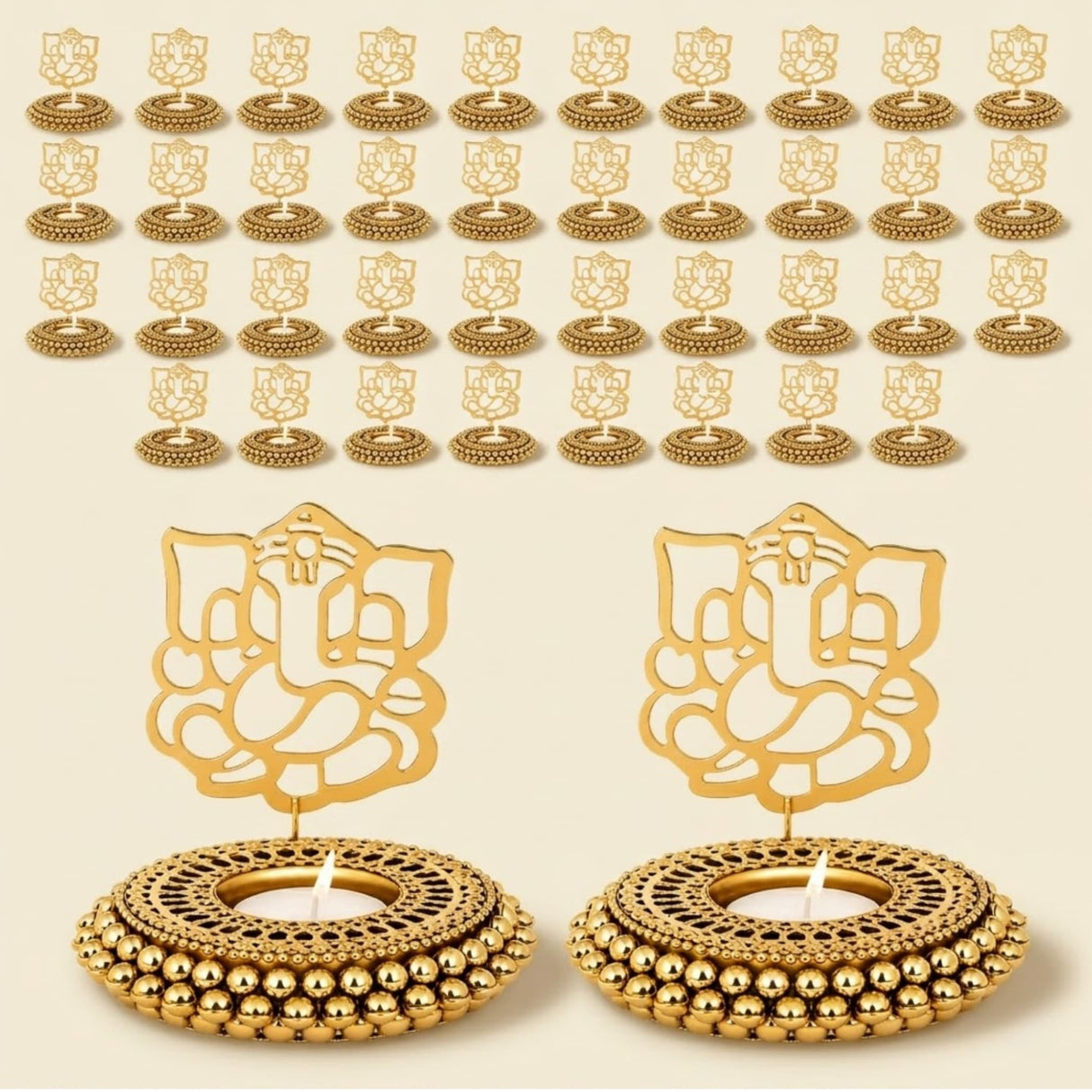 Golden ganesha-themed tealight candle holders with intricate cut-out designs and beaded bases for festive decor