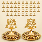 Golden metal tealight candle holder with intricate deity cut-out design and beaded base for festival of light decor