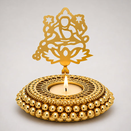 Golden ornate tealight candle holder with intricate filigree and beaded base for diwali christmas hanukkah decor