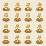 Golden ornate oil lamp holders with intricate filigree designs and beaded bases for festive tealight candle decor