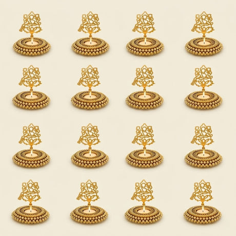 Golden ornate oil lamp holders with intricate filigree designs and beaded bases for festive tealight candle decor