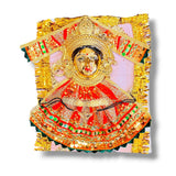 Ornate golden Goddess Mahalaxmi figurine symbolizing divine prosperity and grace