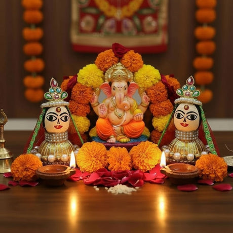 Orange marigold garland with Riddhi Siddhi idols for Diwali decor