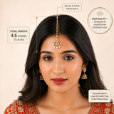 Gold-plated alloy chand maang tikka with intricate floral design and pearl accents for traditional Indian bridal wear