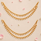 Golden triple strand anklet with small skull charms and hook closure in elegant indian bridal jewelry style