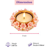 Decorative round gold-tone metal tealight candle holder with white floral design pink centers for weddings and home decor