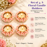Set of four pink and white floral tealight candle holders with gold-tone vintage-inspired bases for table decor