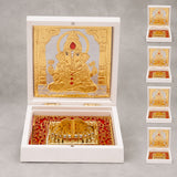 Gold plated ganesh figurine with red gemstone accents in ornate white box for home temple and office decor