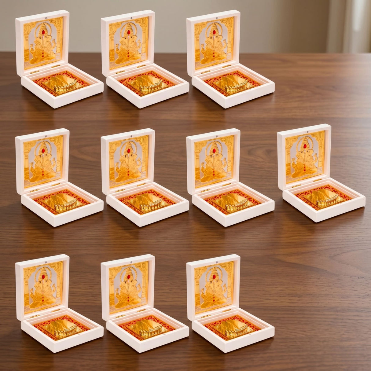 White plastic gold plated ganesha photo frame with gold interior lining and decorative figures for diwali pooja gift