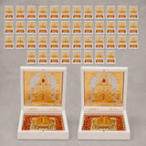 Gold plated ganesh deity figurine set in ornate white boxes with red and gold decorative interiors for home temple and office decor