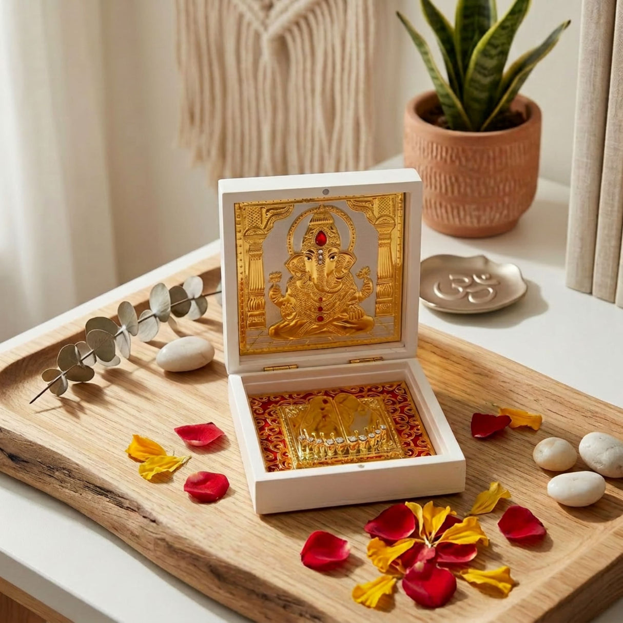 White wooden gold plated ganesha deity box with red gemstone and gold interior for diwali pooja room decor gift