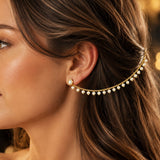 Gold toned pearl ear cuff with delicate chain and evenly spaced white faux pearls for bridal and festive wear