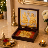 Elegant dark wood gold plated laxmi ganesh photo frame with charan paduka and intricate silver background detailing