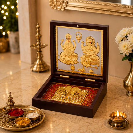 Elegant dark wood gold plated laxmi ganesh photo frame with charan paduka and intricate silver background detailing