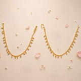 Traditional gold tone ear chains for women with delicate dangling floral charms elegant indian bridal jewelry accessory