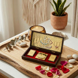 Large gold plated photo frame with intricate radha krishna illustration and golden charan paduka for pooja decor