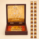 Gold plated radha krishna photo frame with golden ornate embossed lid and intricate diorama on red base for spiritual decor
