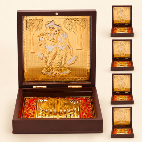Gold plated radha krishna photo frame with charan paduka featuring a golden ornate box with red patterned interior lining