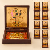 Gold plated Shrinath Krishna deity figurine in an ornate dark wood box with red velvet lining for spiritual decor