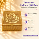 A square golden metal decorative gift box with textured surface and ornate ganesha design for festive occasions