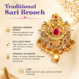 Gold-colored traditional sari brooch with intricate floral motifs red gemstone and dangling amber stones for bridal wear