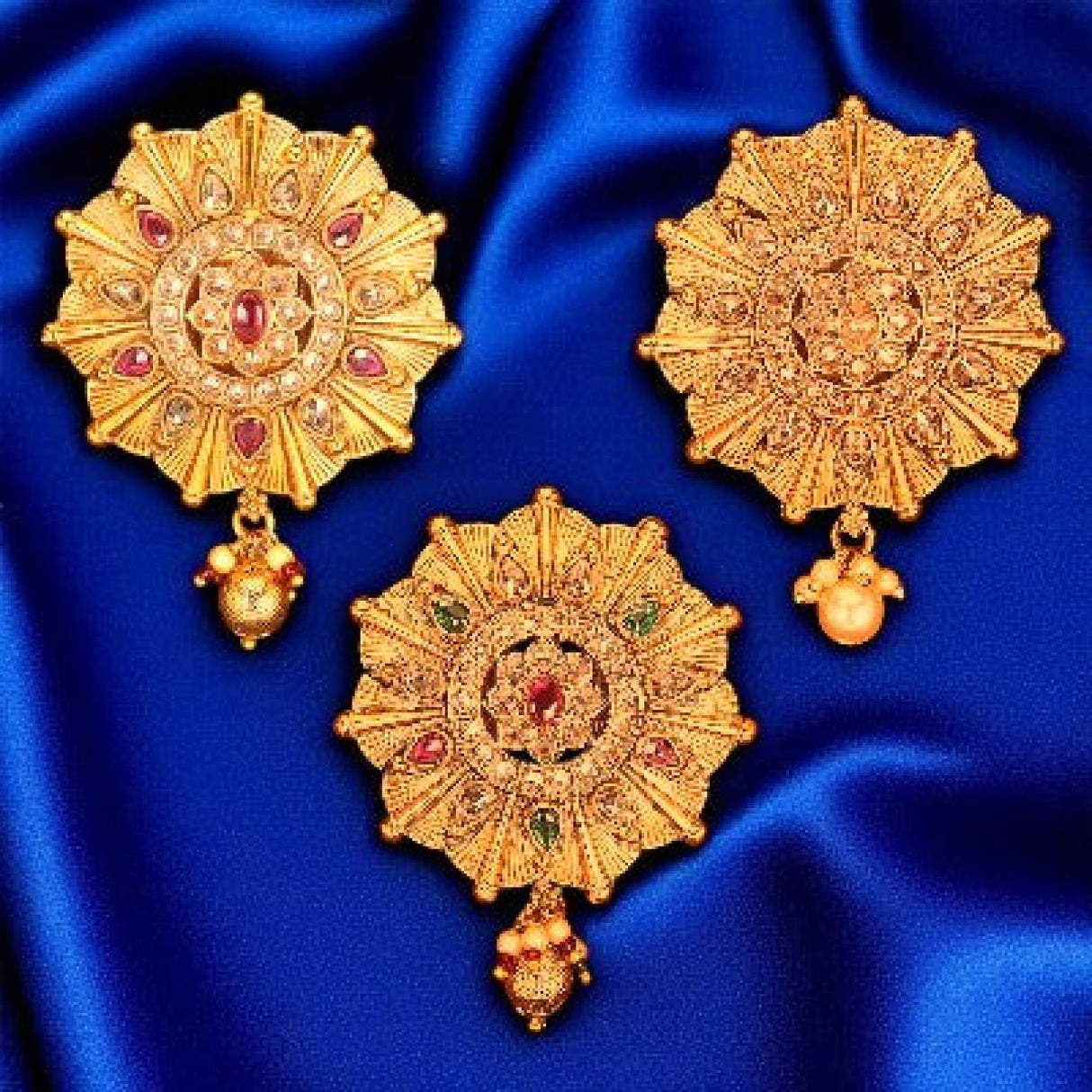 Ornate gold pendants from traditional Kundan Bollywood jewelry collection for Indian sarees