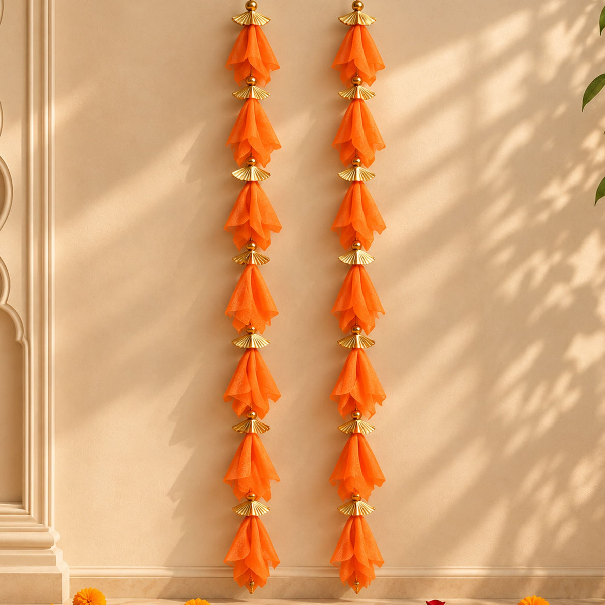 Orange sheer fabric gotta patti net backdrop with gold-toned metallic fan embellishments for diwali eid and wedding decor
