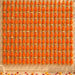 Orange tassels with gold decorative caps hanging in neat vertical rows on gotta patti net backdrop for diwali eid wedding decor