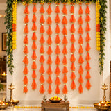 Orange sheer fabric tassels with gold metallic connectors in gotta patti net backdrop for diwali eid and wedding decor