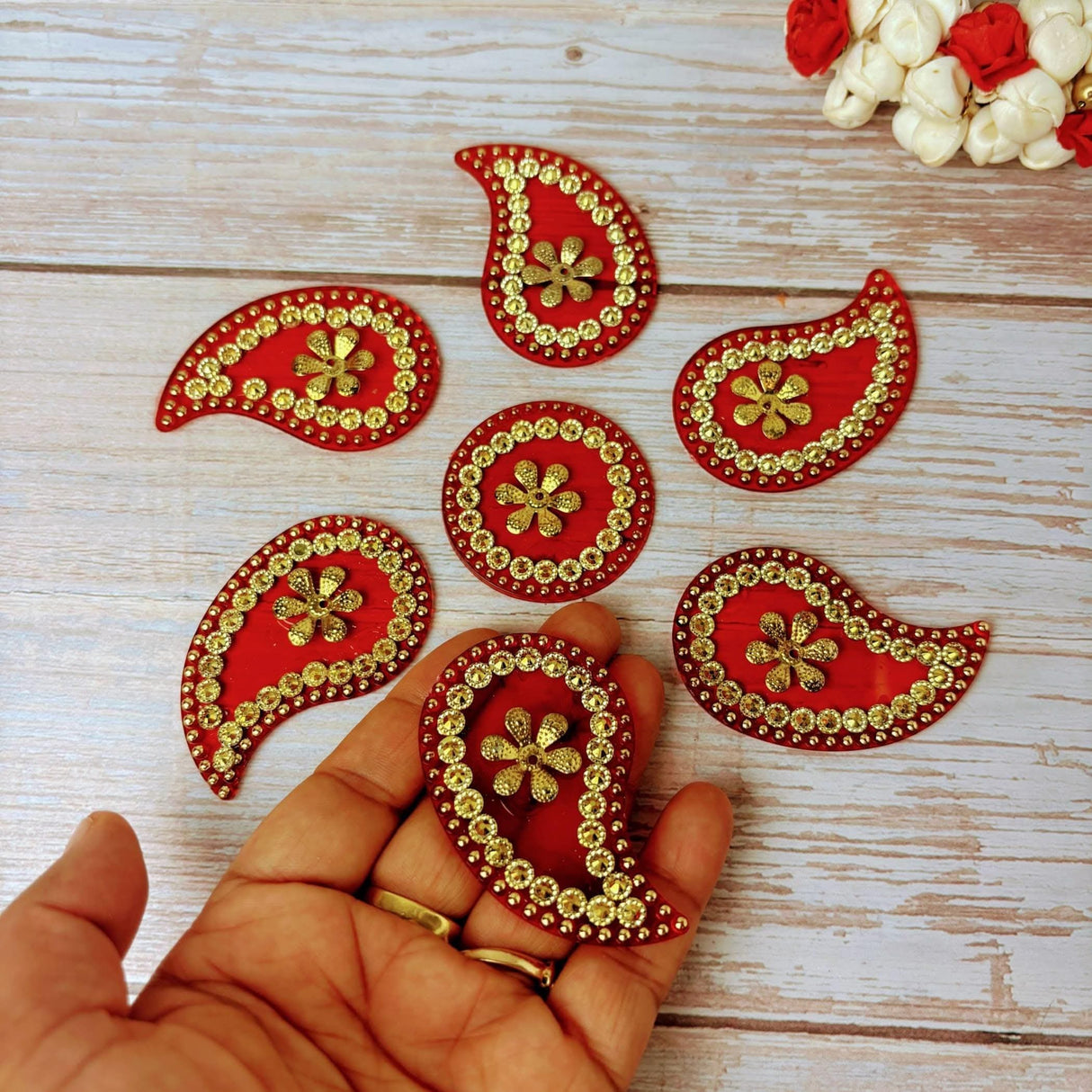 Red gold paisley stickers with floral patterns in Gudi Padwa hamper