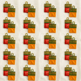 Red and orange satin haldi kumkum packets with green embroidered borders and gold metal loops for hindu wedding puja