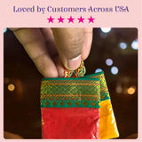 A vibrant red and green embroidered fabric pouch with gold thread for haldi kumkum packets in festive Indian wedding set