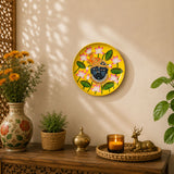 Decorative wooden round wall plate hand painted with a dark blue face, gold and pink lotus on vibrant yellow background