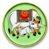 Decorative wooden circular plate with hand painted white cows and red blue gold patterns for Indian wall décor