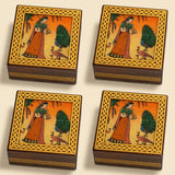 Wooden jewelry box small handcarved with intricate gold lattice and hand-painted woman in traditional dress with peacocks