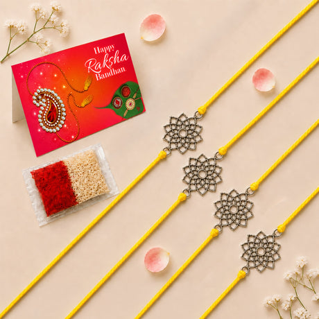 Four yellow cord designer lotus charm rakhis with silver filigree flower pendants for raksha bandhan gift