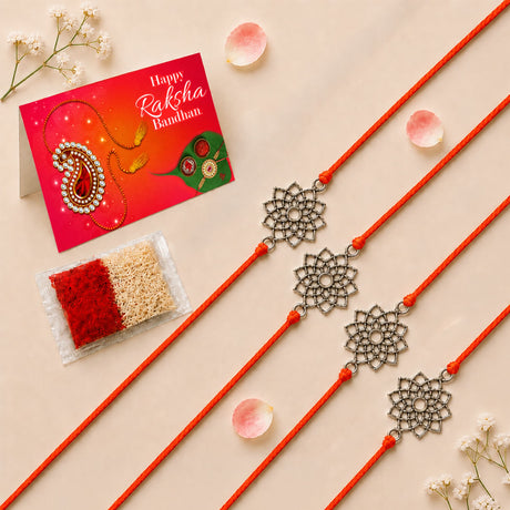 Four orange cord designer lotus charm rakhi bracelets with intricate silver toned floral pendants for Raksha Bandhan gift