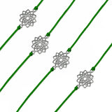 Four green cord designer lotus charm rakhis with silver-toned floral pendants for raksha bandhan protection gift