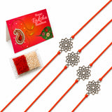 Four orange cord designer lotus charm rakhis with intricate silver toned floral pendants for raksha bandhan gift