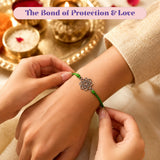 A delicate green cord designer lotus charm rakhi with silver toned lotus flower for raksha bandhan gift