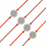 Four orange cord designer lotus charm rakhis with silver toned floral pendants for Raksha Bandhan protection gift