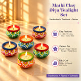 Handmade clay matki diya tealight holders with vibrant geometric patterns in green red blue and orange for Diwali pooja
