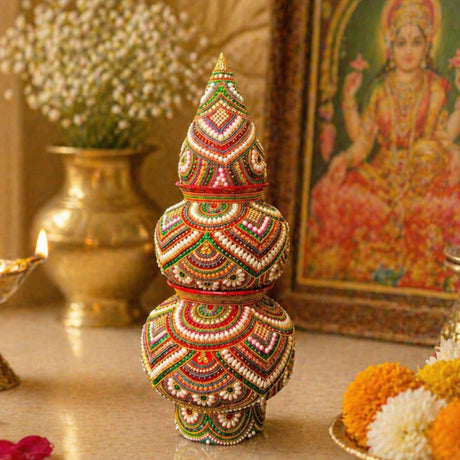 Decorative kalash made of mild steel with vibrant red green and gold beads for pooja wedding and festival decor