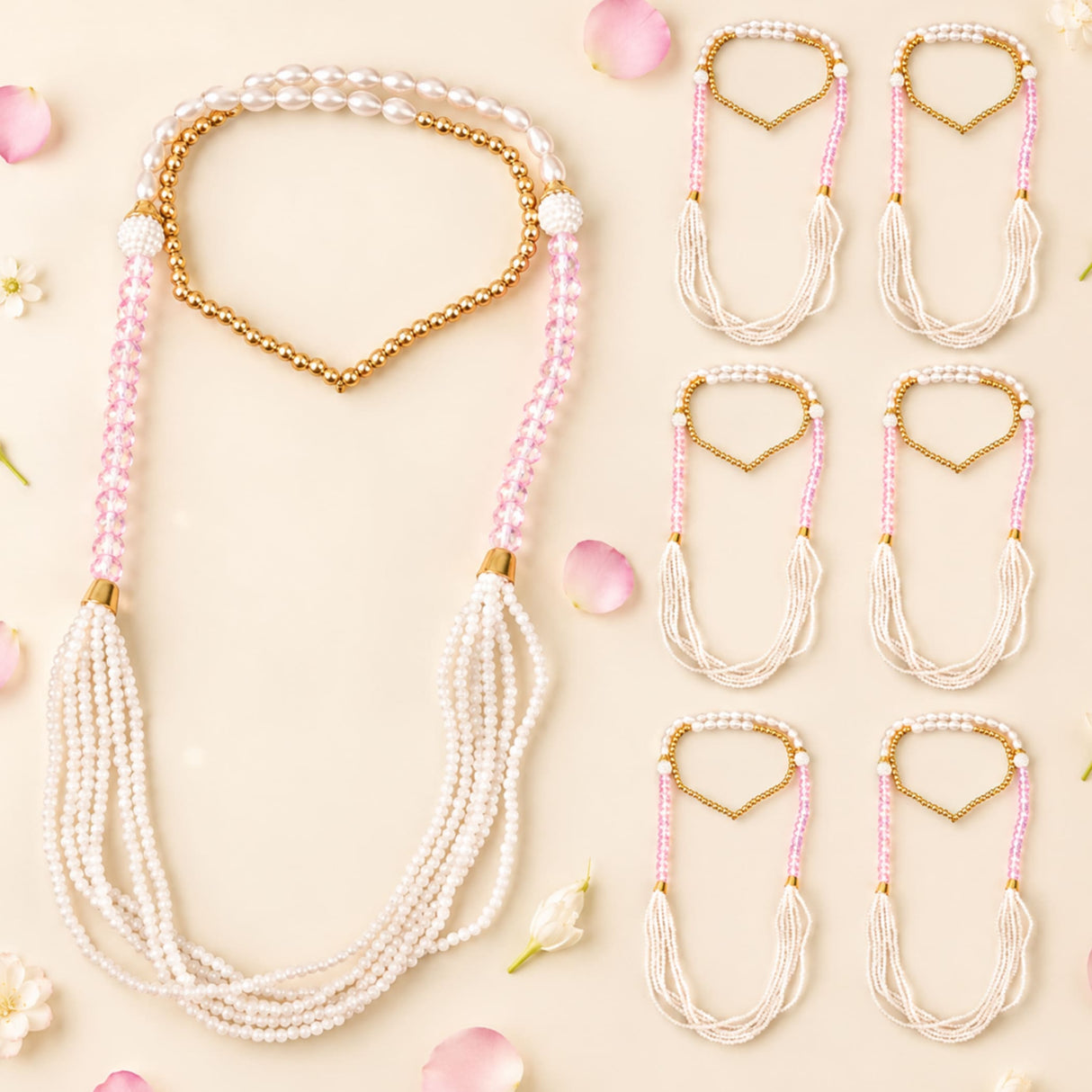 Handmade wedding swagat mala set featuring delicate pink and white beaded motifs with gold heart clasp and pearl strands
