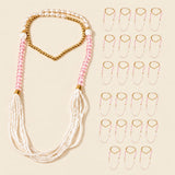 A delicate pink and white handmade swagat mala necklace with gold-toned accents for Indian wedding celebrations
