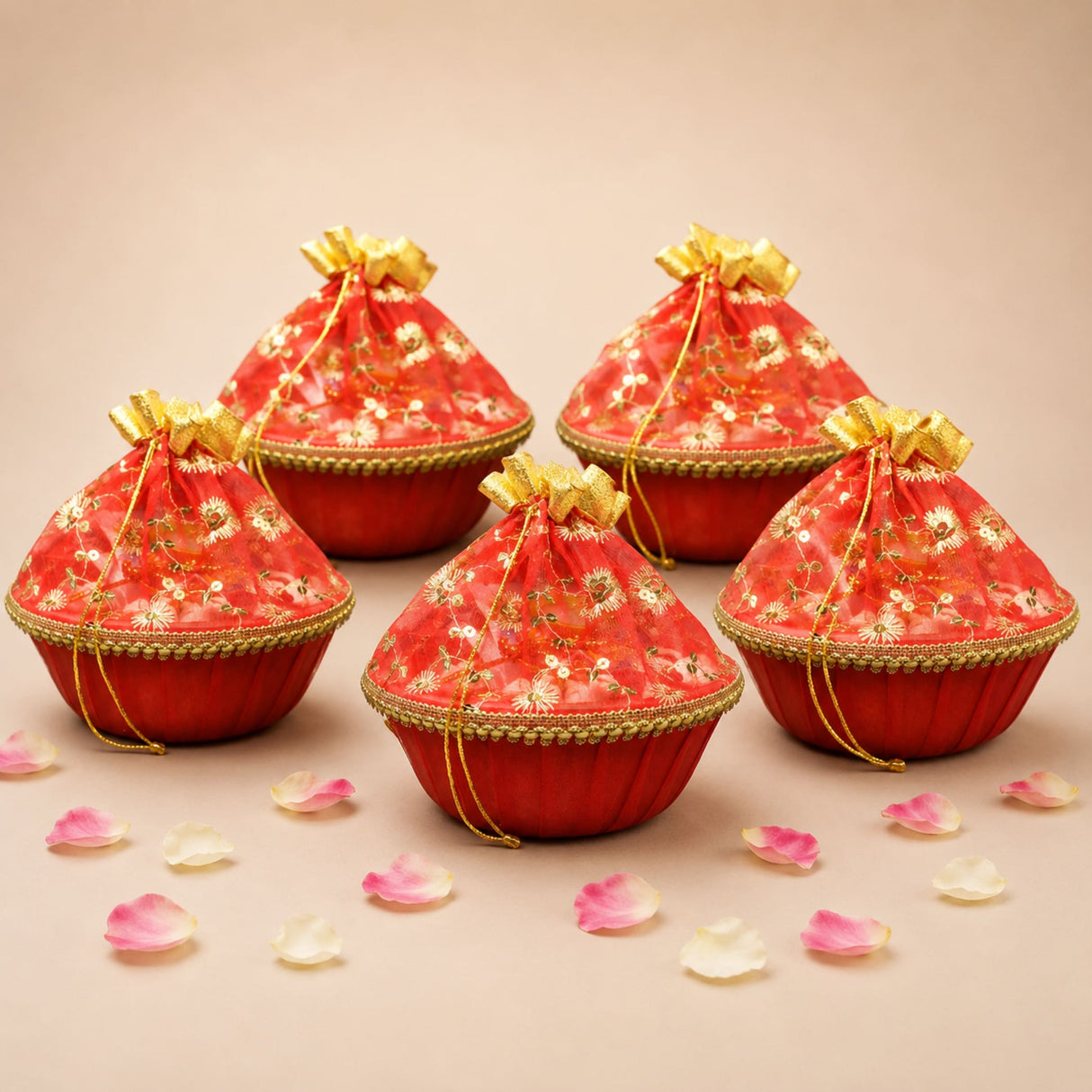 Red embroidered gift pouches with gold floral patterns and matching drawstrings in a 5ct 10 inch handmade gift basket