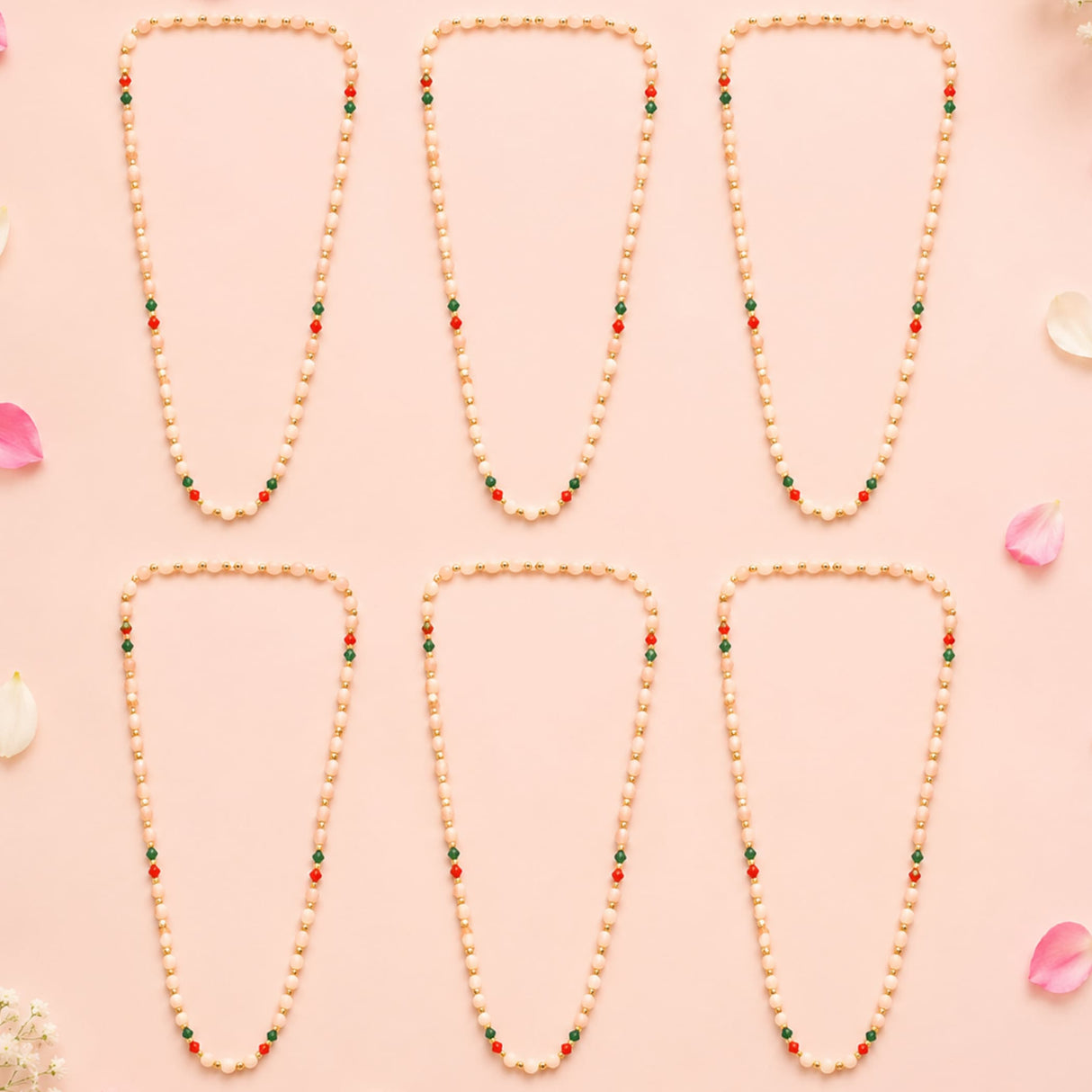 Six handmade barati swagat mala necklaces with cream artificial moti pearls and red green beads for wedding celebrations