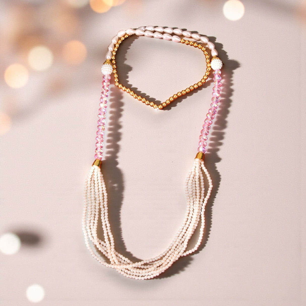 Handmade Swagat Mala multi-strand pearl necklace with gold accents and pink beads