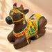 Hand-painted wooden nandi cow idol with vibrant yellow red and green floral patterns for home temple pooja decor