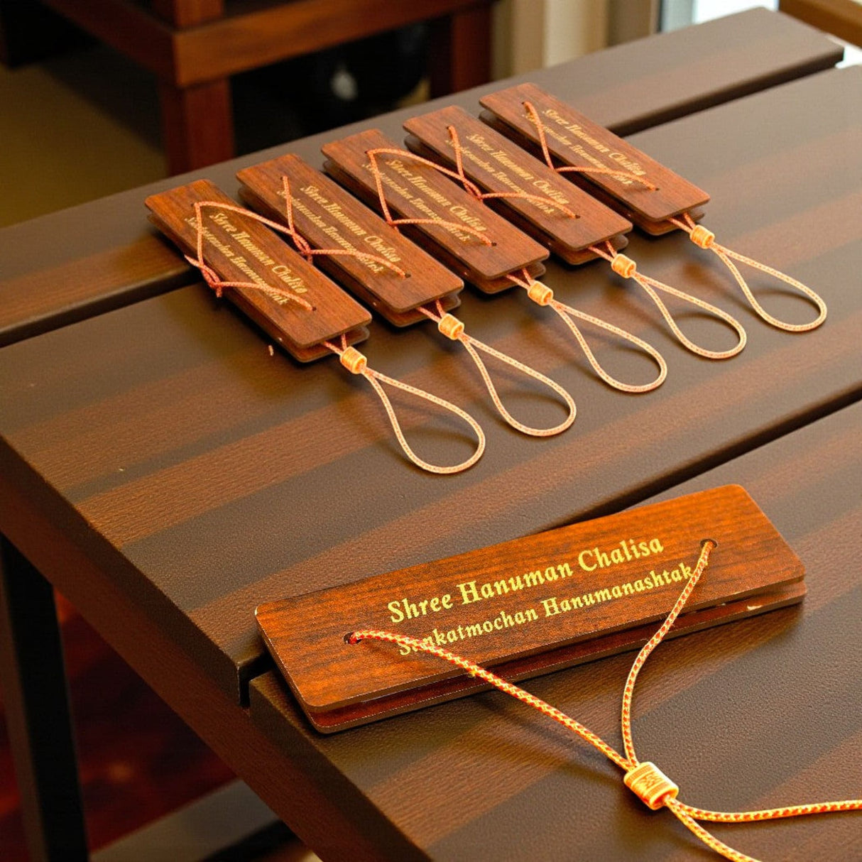 Wooden prayer beads with gold cord on Hanuman Chalisa book